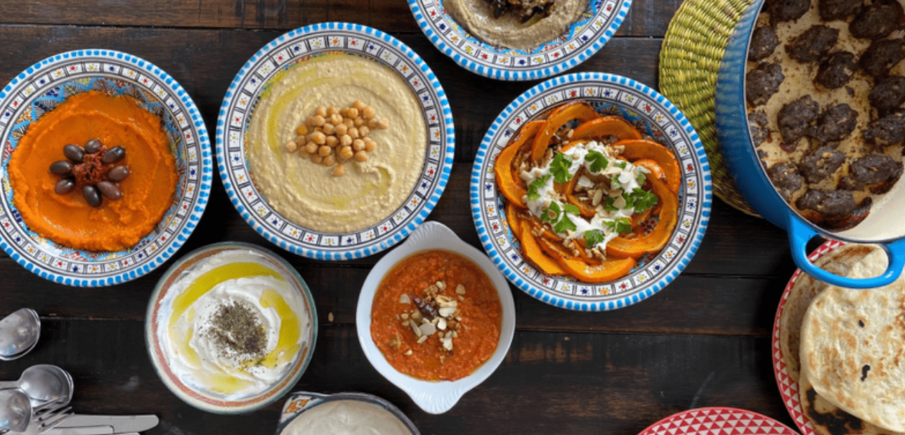 Selection of Middle Eastern mezes including hummus