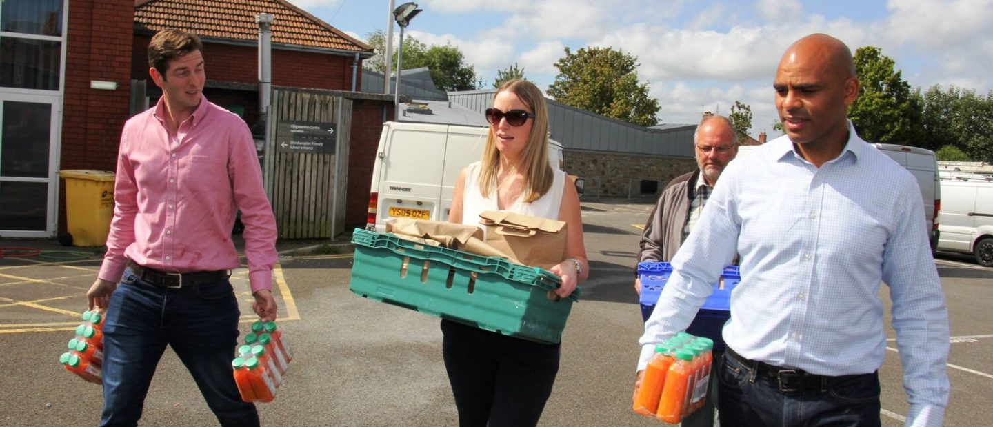 Mayor of Bristol, Marvin Rees and Feeding Bristol staff carrying food