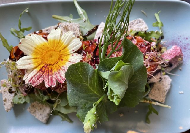 Plate of food decorated with flowers from Eat Your Greens